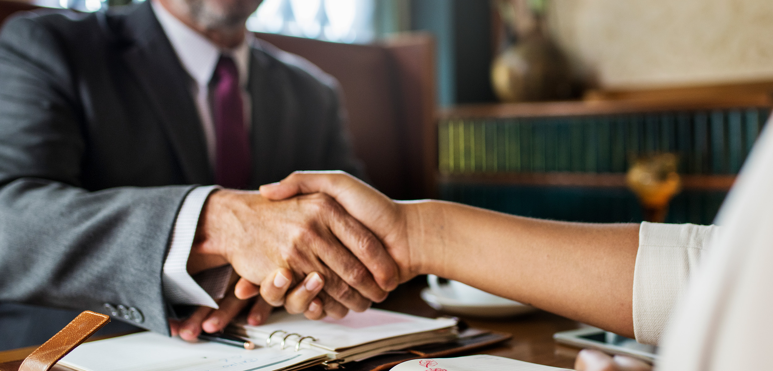 Experienced Lemon Law attorney meeting with client at Krukas & Vicario Law Experienced Lemon Law attorney meeting with client at Krukas & Vicario Law